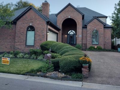 brick home with dark painted trim