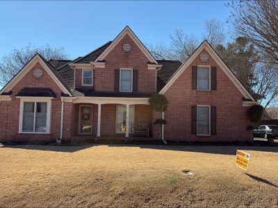 brick home with painted trim