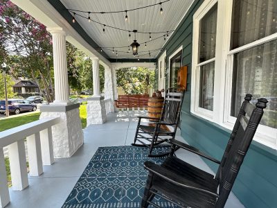 covered porch with blue siding paint update