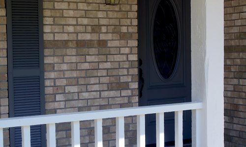 Brick and Blue Shutters