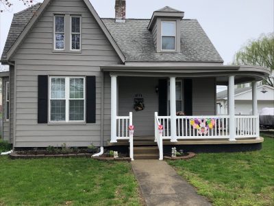 House with Gray Aluminum Exterior after completed painting project by CertaPro Painters of Belleville, IL