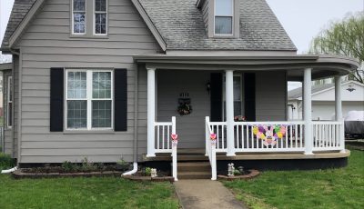 House with Gray Aluminum Exterior after completed painting project by CertaPro Painters of Belleville, IL