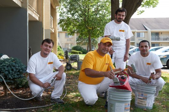 certapro painter team members in front of commercial job