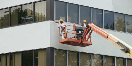 exterior painting on a lift