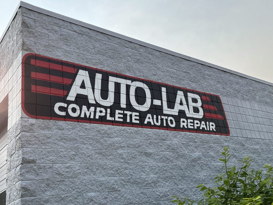 Commercial exterior painting on Auto Lab logo Preview Image 1