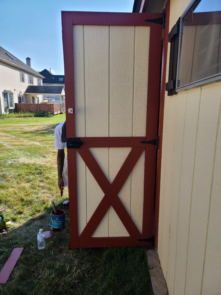 shed door after carpentry fixes & repainting