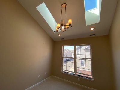 interior room with skylight painting
