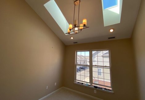 interior room with skylight painting