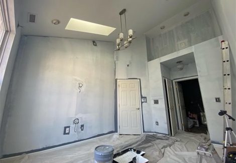 interior room with skylight before painting