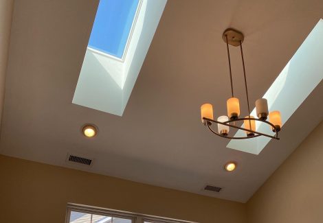 interior room with skylight painting