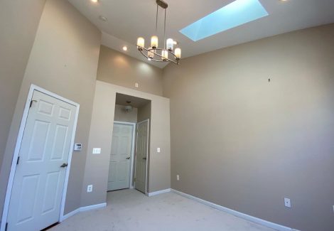 interior room with skylight after painting