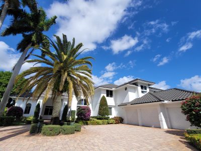 white house with black roof residential painting project boca raton fl