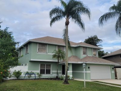green and white painted house in boca raton fl
