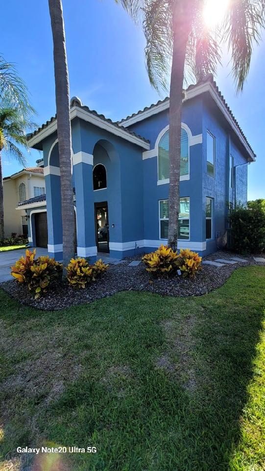 house exterior painted blue Preview Image 1