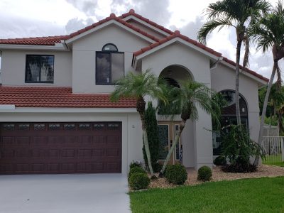 exterior of a house that is painted beige and brown