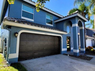 blue house garage exterior