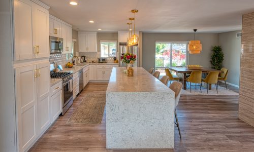 Kitchen With Large Island & White Cabinets