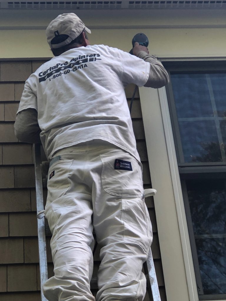 painter working on ladder