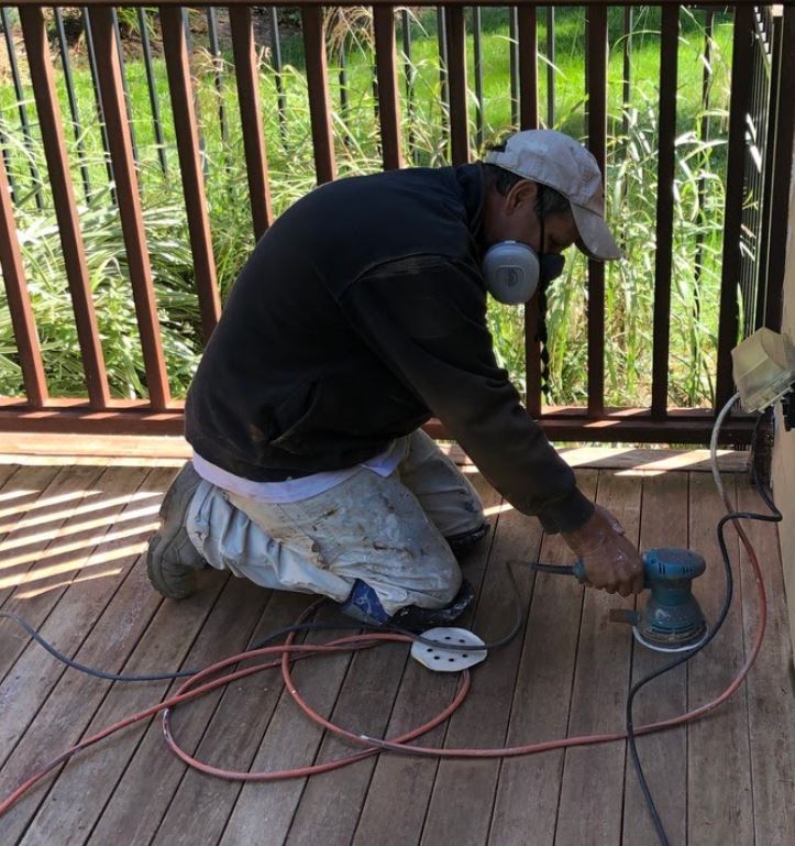 sanding a deck to prep for painting