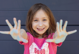 Girl with chalk on her hands