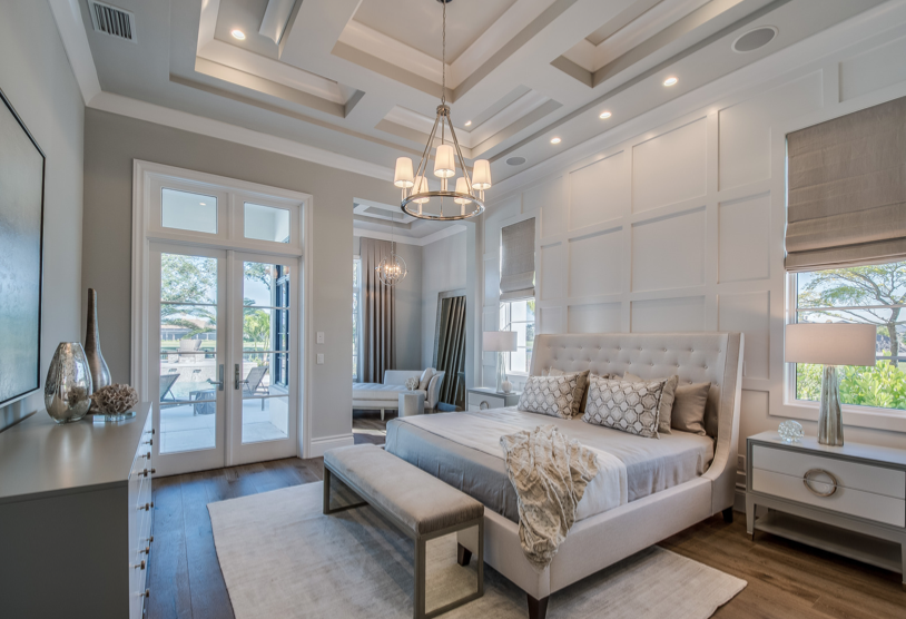 Tray Ceiling And Ornamental Bedroom