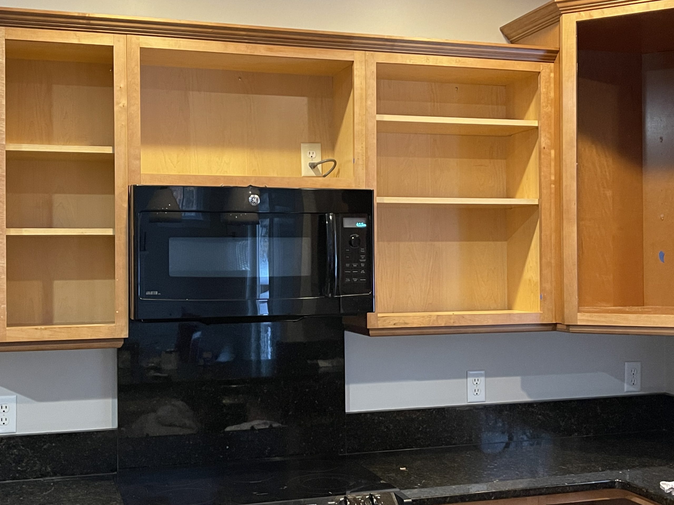 Cherry cabinets with doors missing