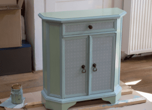 Tiffany blue night stand with a top drawer and two doors.