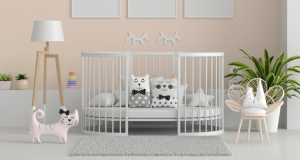 Pink baby room with white crib