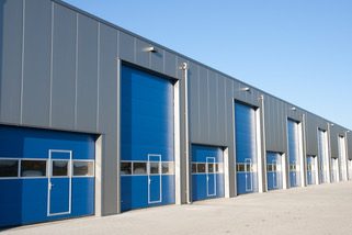 Commercial Warehouse exterior painting by CertaPro painters in South Shore, MA