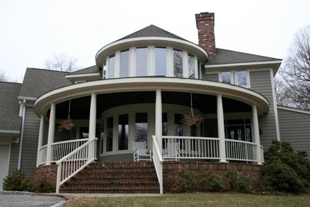 Home with beautiful rounded farmer's porch