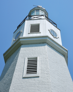 lighthouse with white painted brick exterior