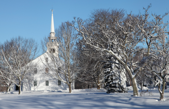 White church in Snow in Cohasset