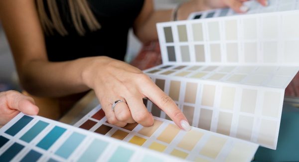 person reviewing colors for interior painting project