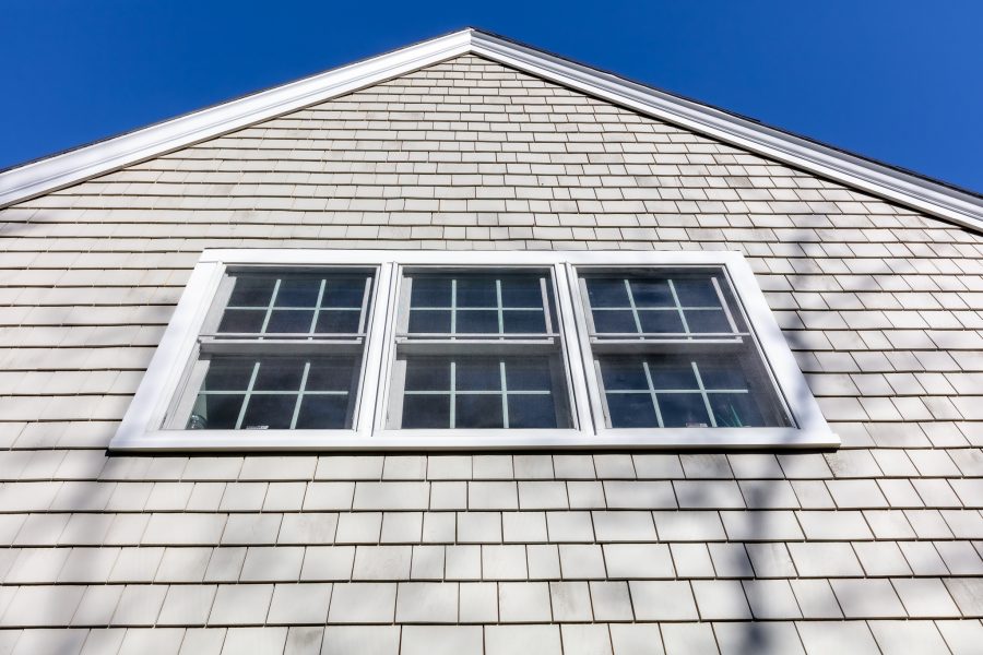 Three windows on side of home with white painted trim. Preview Image 4