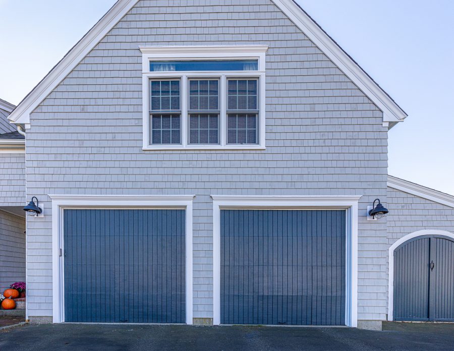 Blue painted garage doors on side of home. Preview Image 7