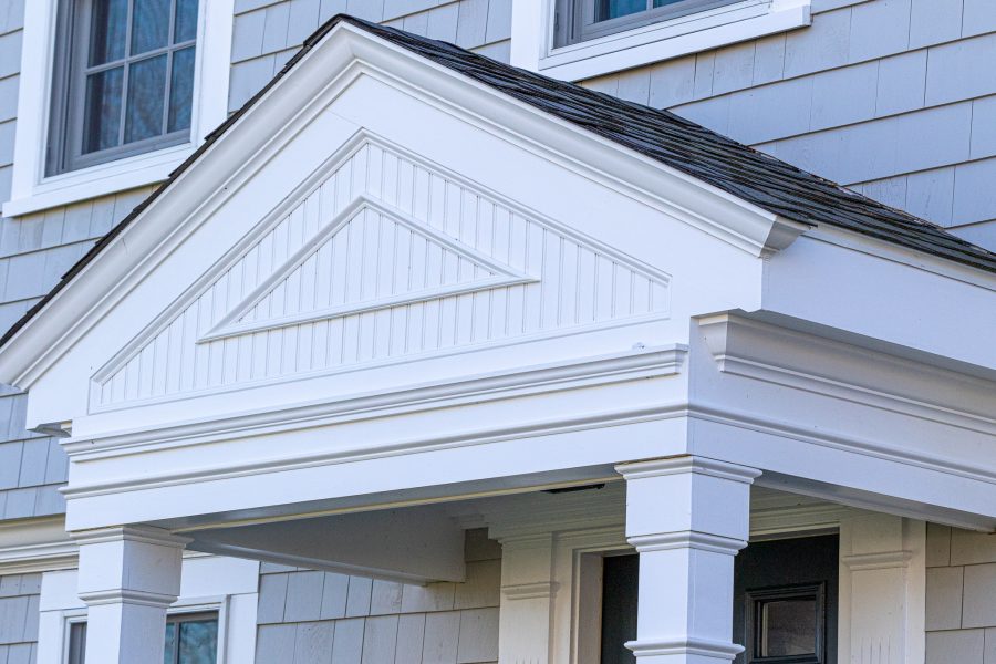 White painted decorative woodwork on front porch of home. Preview Image 9