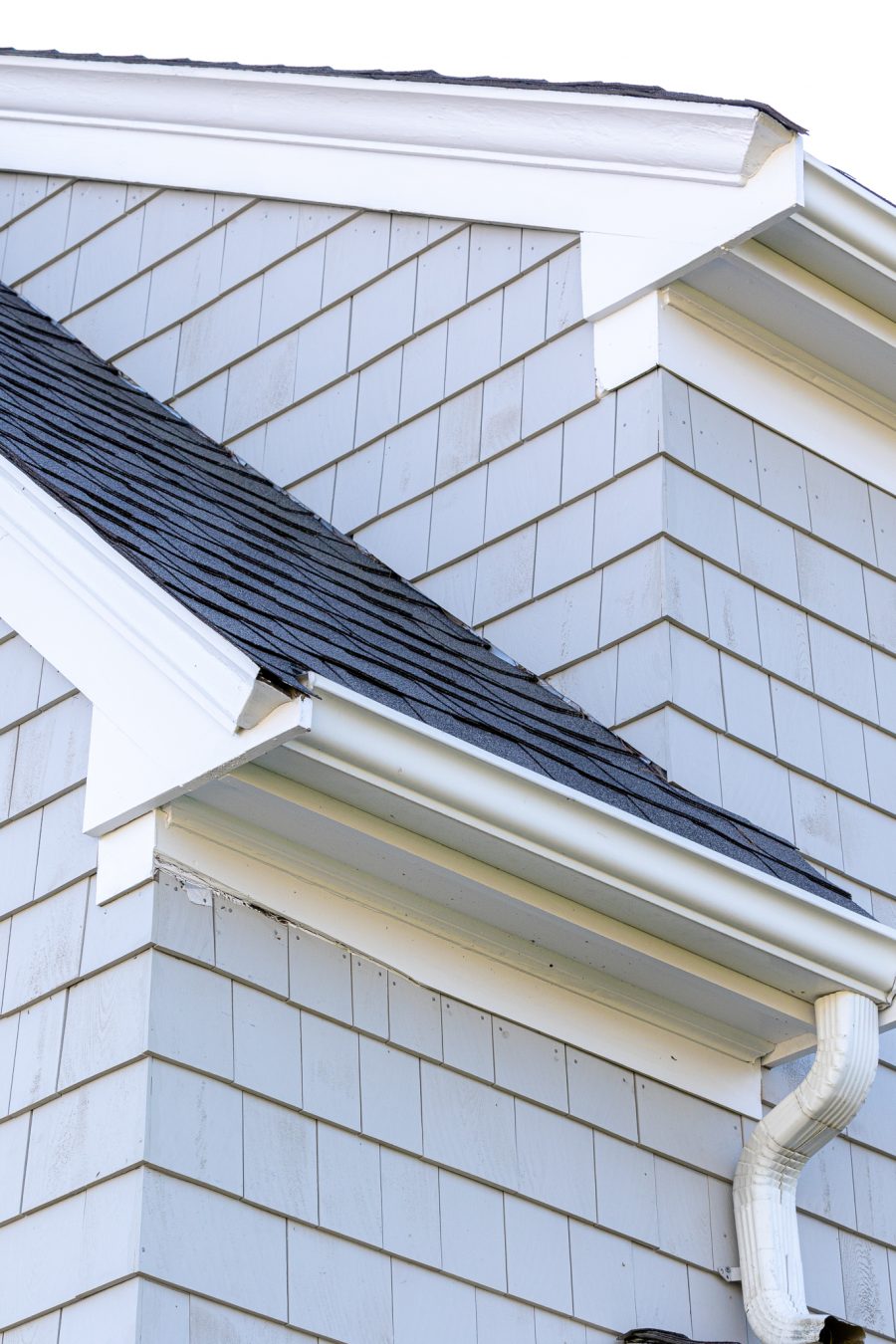 Soffits and trim painted white on gray stained shingle home. Preview Image 12