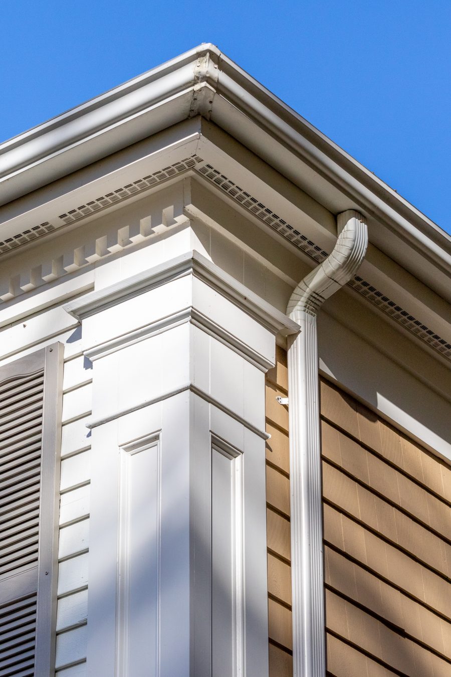 Corner view of white painted decorative exterior trim Preview Image 1