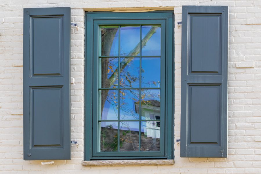 close photo of painted window shutters and window trim Preview Image 7