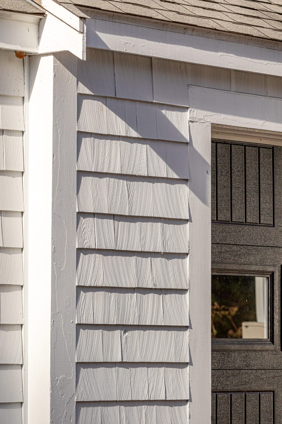 Close view of painted shingle siding and trim. Preview Image 5