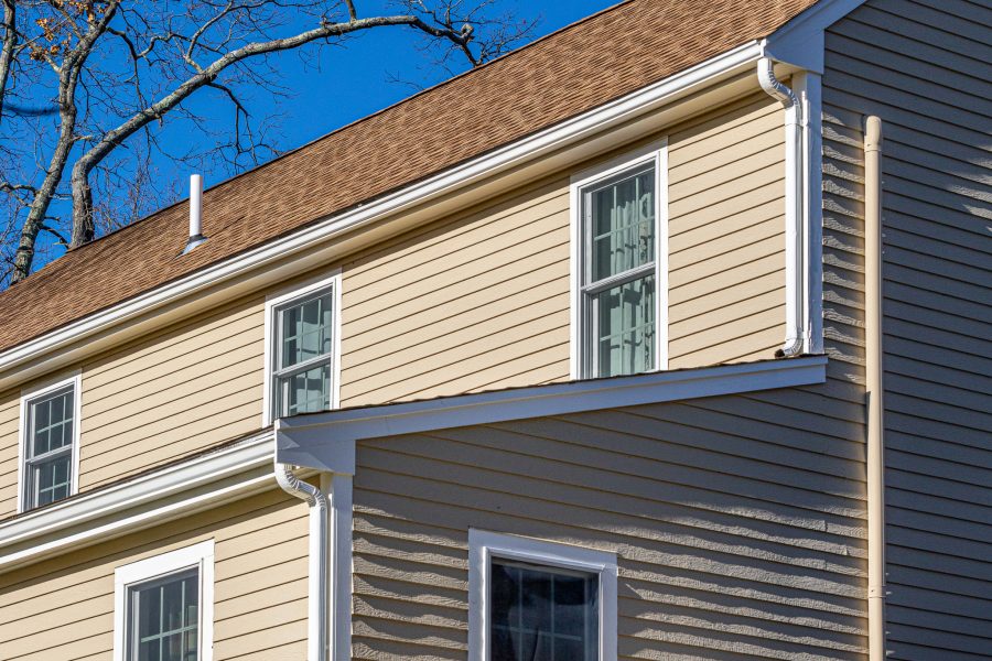 Tan siding with white trim on home in Abington MA Preview Image 2