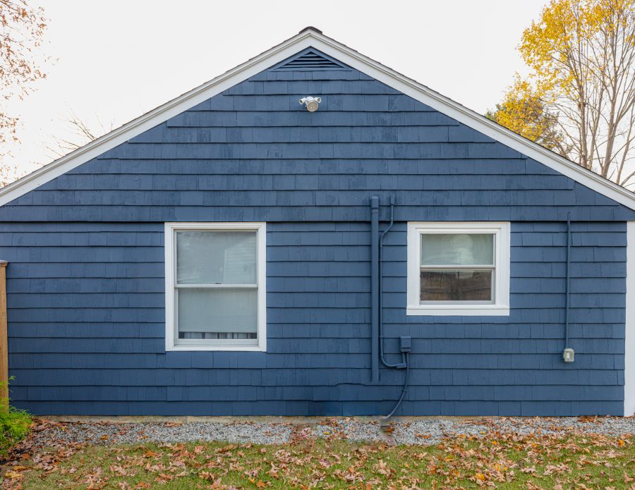 side of home after shingles painted blue. Preview Image 2