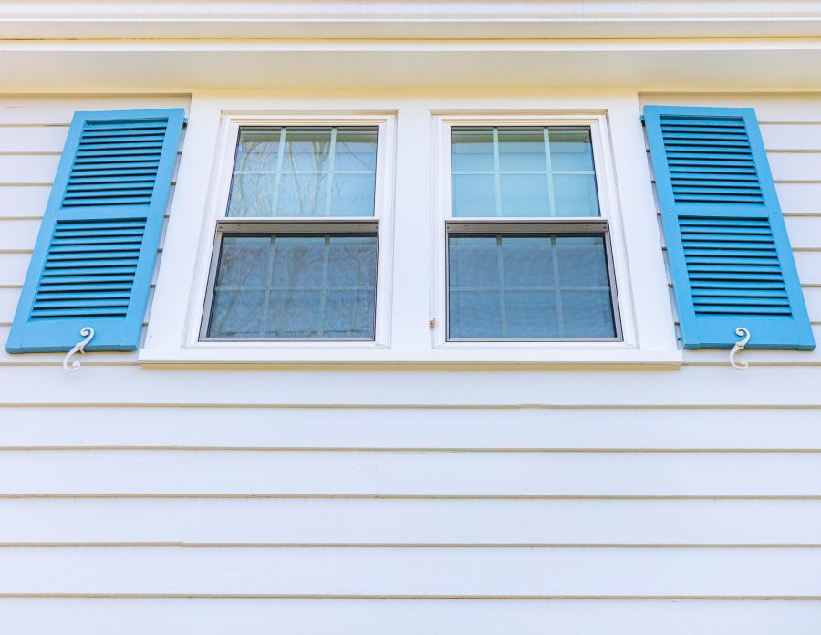 light blue painted shutters on light gray home Preview Image 2