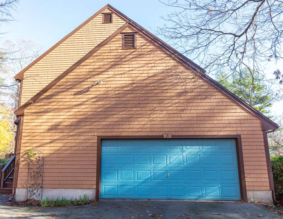 Side view of painted garage door trim and shingles. Preview Image 2