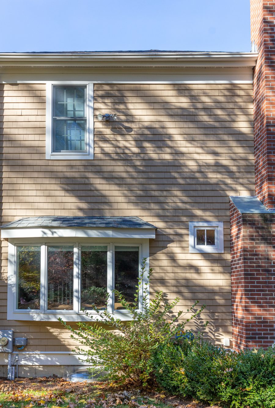 bay window with white trim and tan cedar shingle siding Preview Image 7