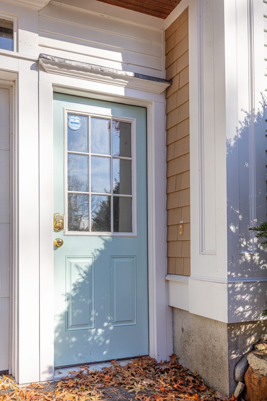 Light blue painted front door on white home. Preview Image 9