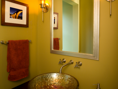 Gold powder room walls with gold sink