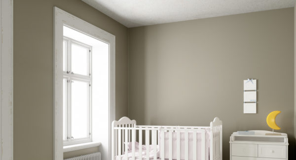 Gray nursery with white furniture