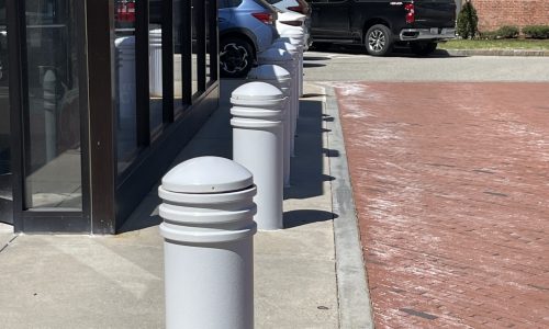 Painting to bollards at exterior of hospital