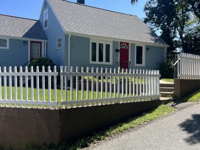 Darling Weymouth home with white picket fence - house is painted blue